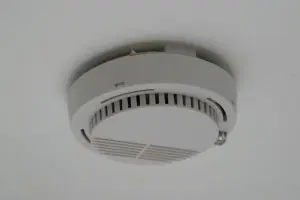 smoke detectors in the home should be placed on the ceiling or high on the walls