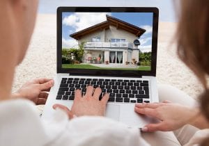 Couple looking at house on computer