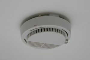 smoke detectors in the home should be placed on the ceiling or high on the walls